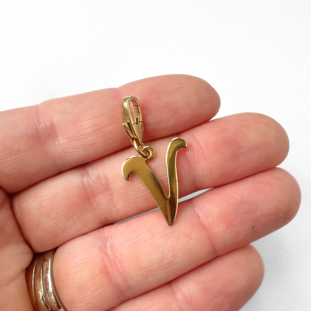 Vintage gold plated "V" monogram charm