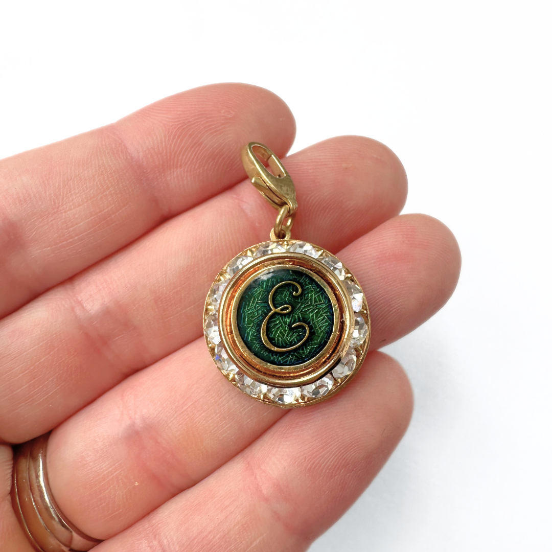 Vintage clear rhinestone and green enamel "E" monogram charm