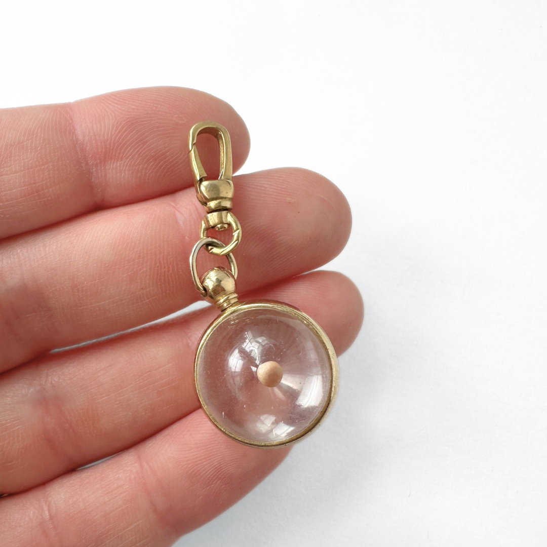Vintage mustard seed transparent orb charm