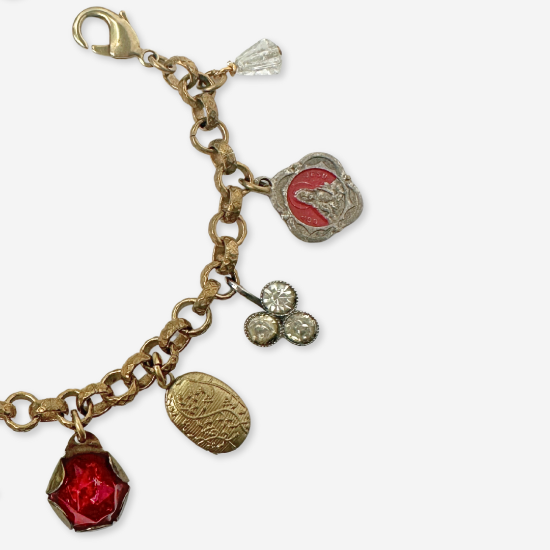 Repurposed vintage red and brass mixed charm bracelet