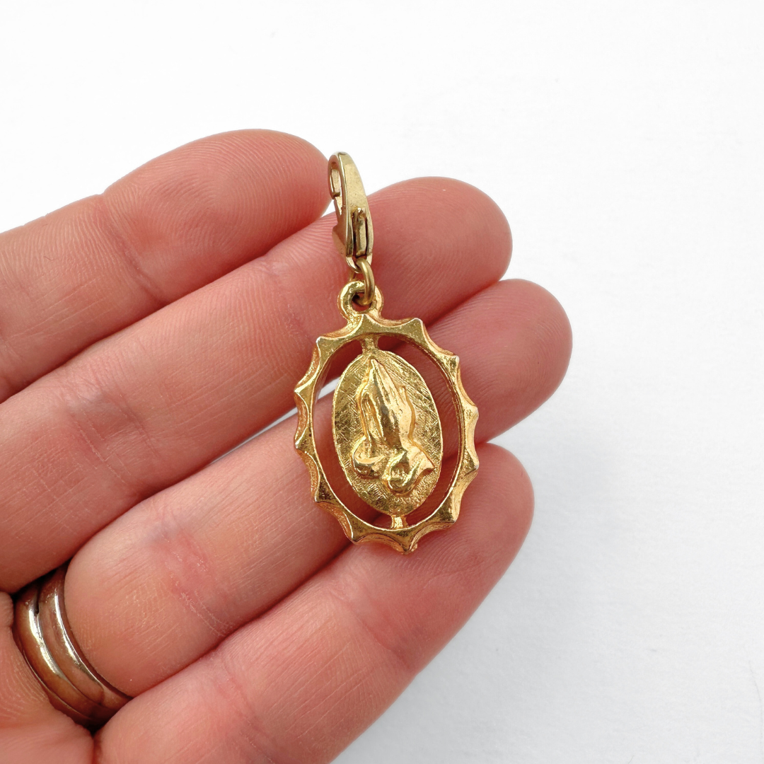 Vintage gold tone praying hands oval charm