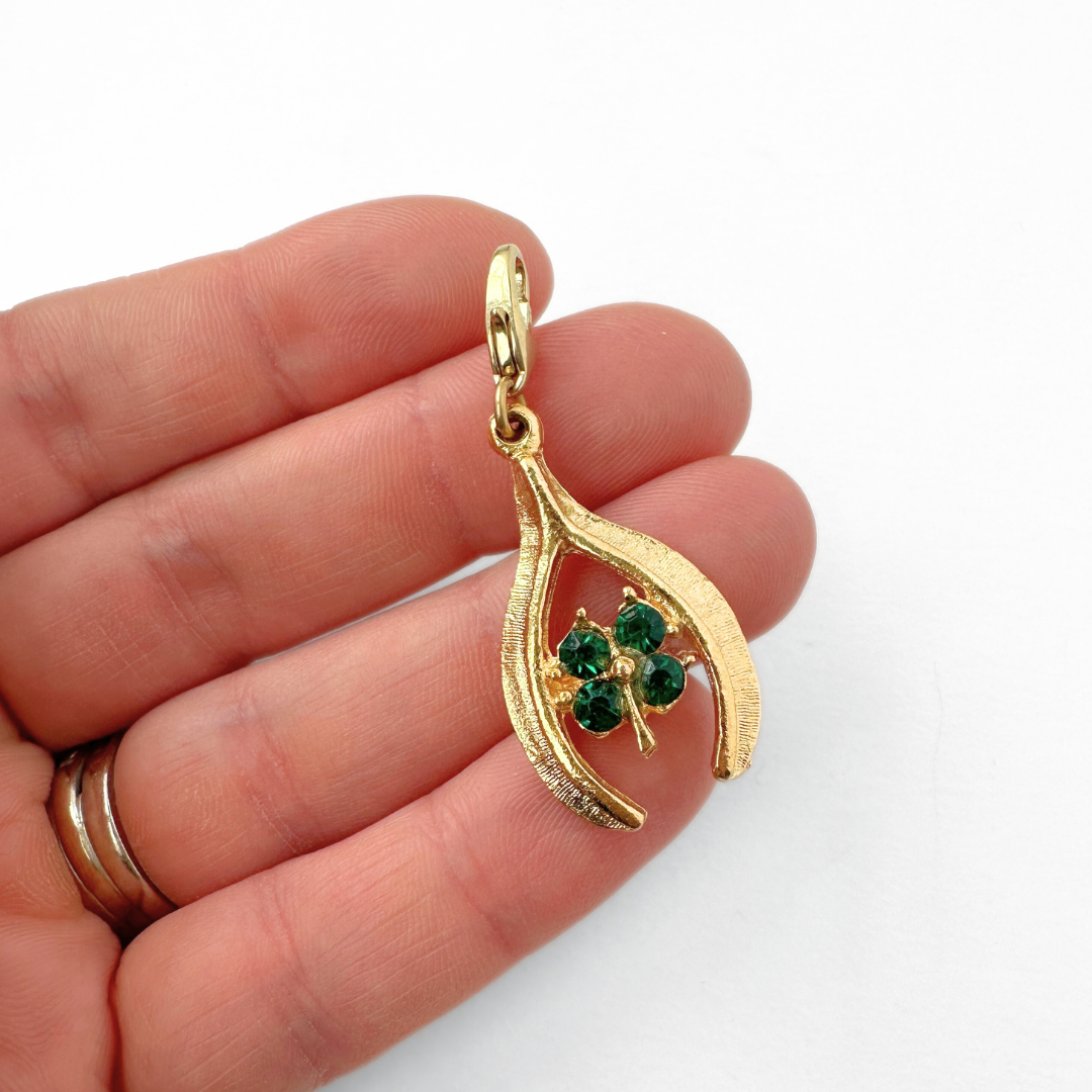 Vintage large gold tone wishbone charm with green clover center