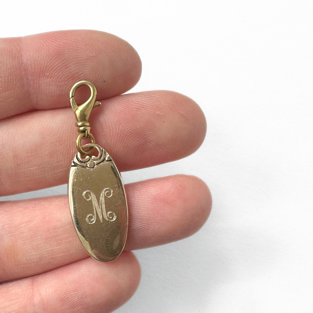Vintage mall oval gold plated "M" monogram charm