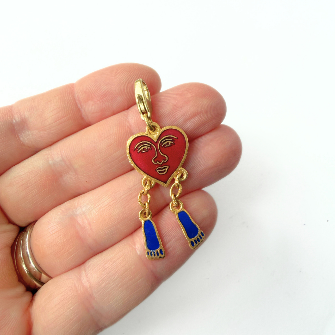 Vintage surrealist enamel heart and dangling feet charm