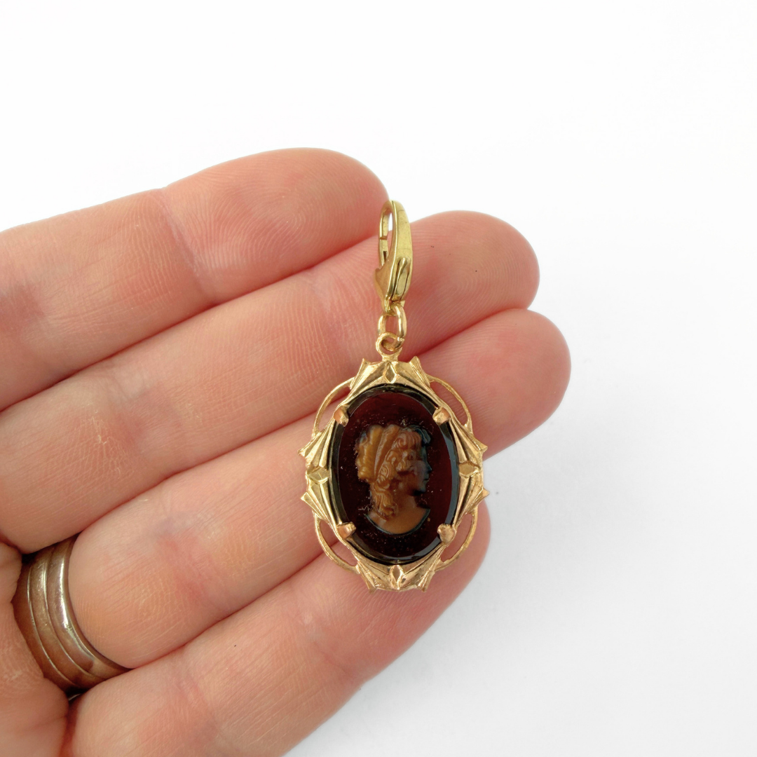 Vintage brown glass cameo charm with brass frame