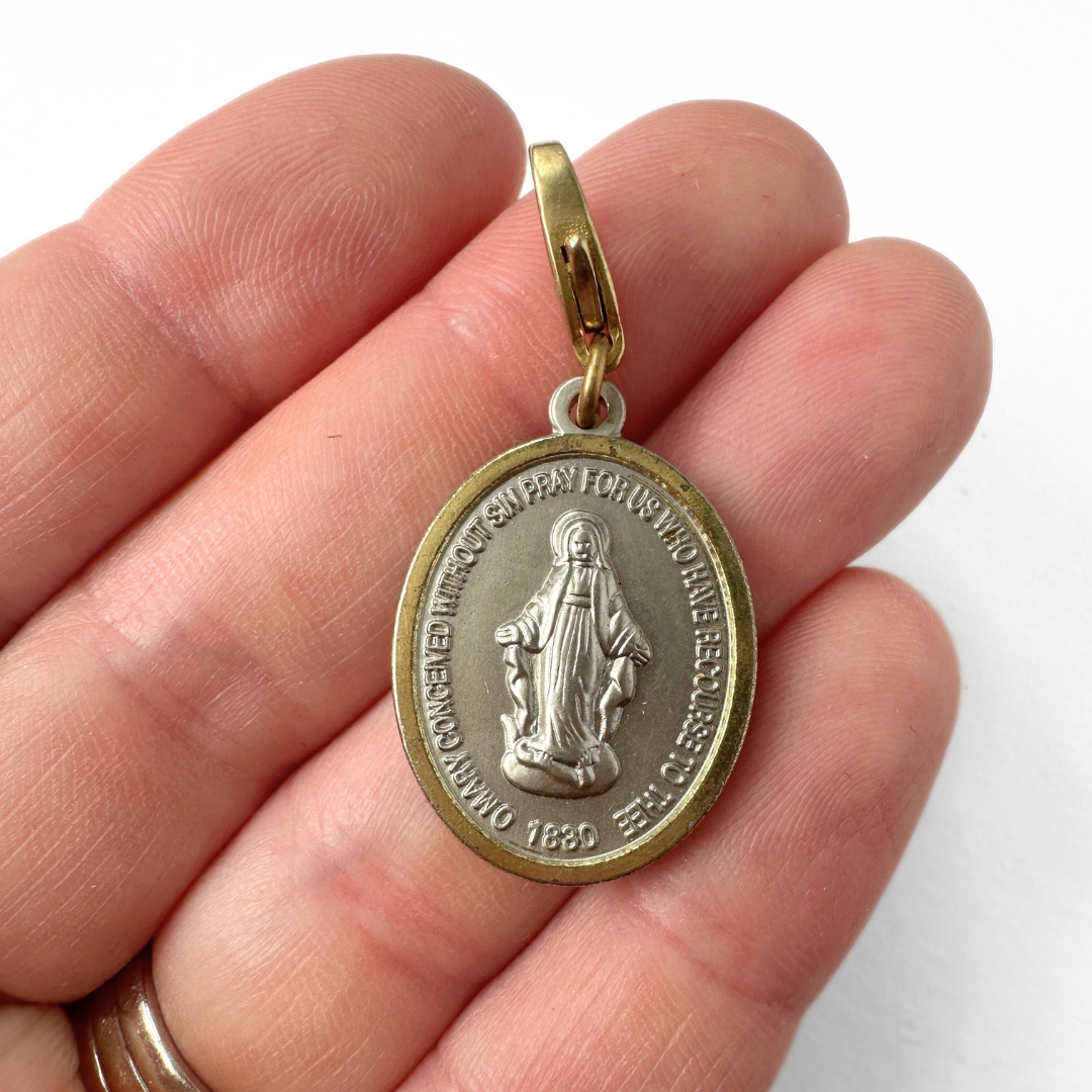 Vintage gold and silver Miraculous Medal oval charm