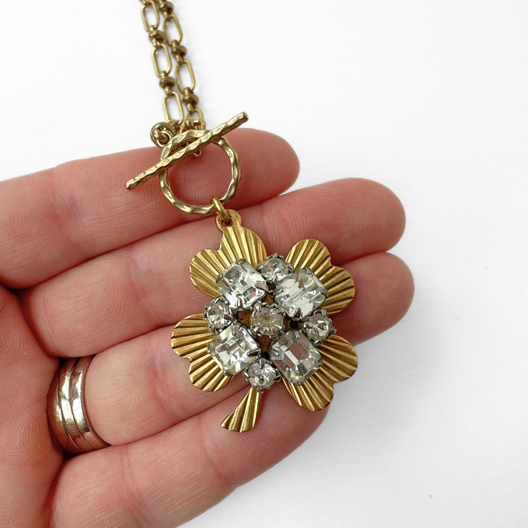 Large solid brass four leaf clover pendant with vintage clear rhinestone embellishment on brass toggle chain