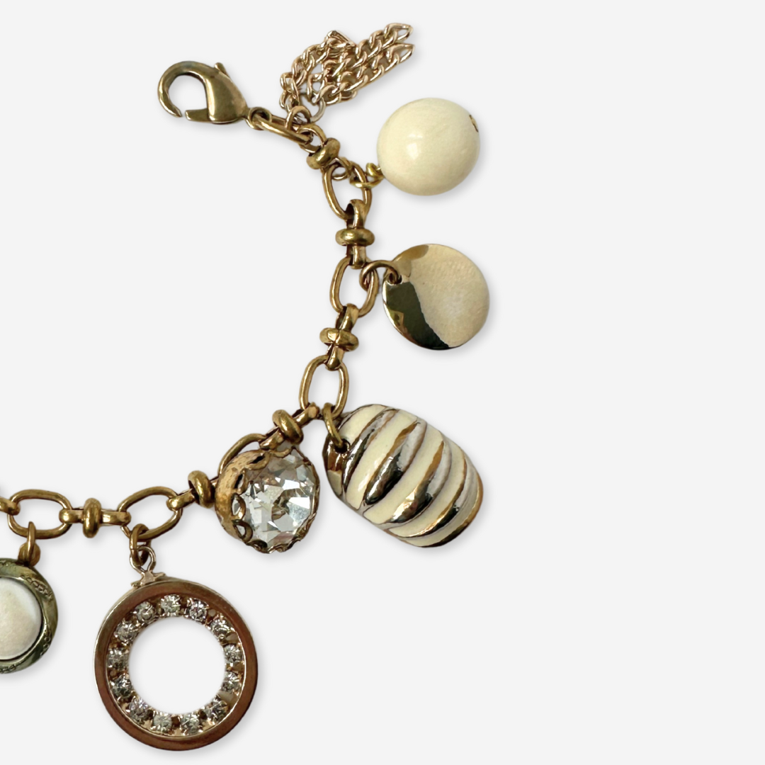 Repurposed vintage cream and gold mixed charm bracelet