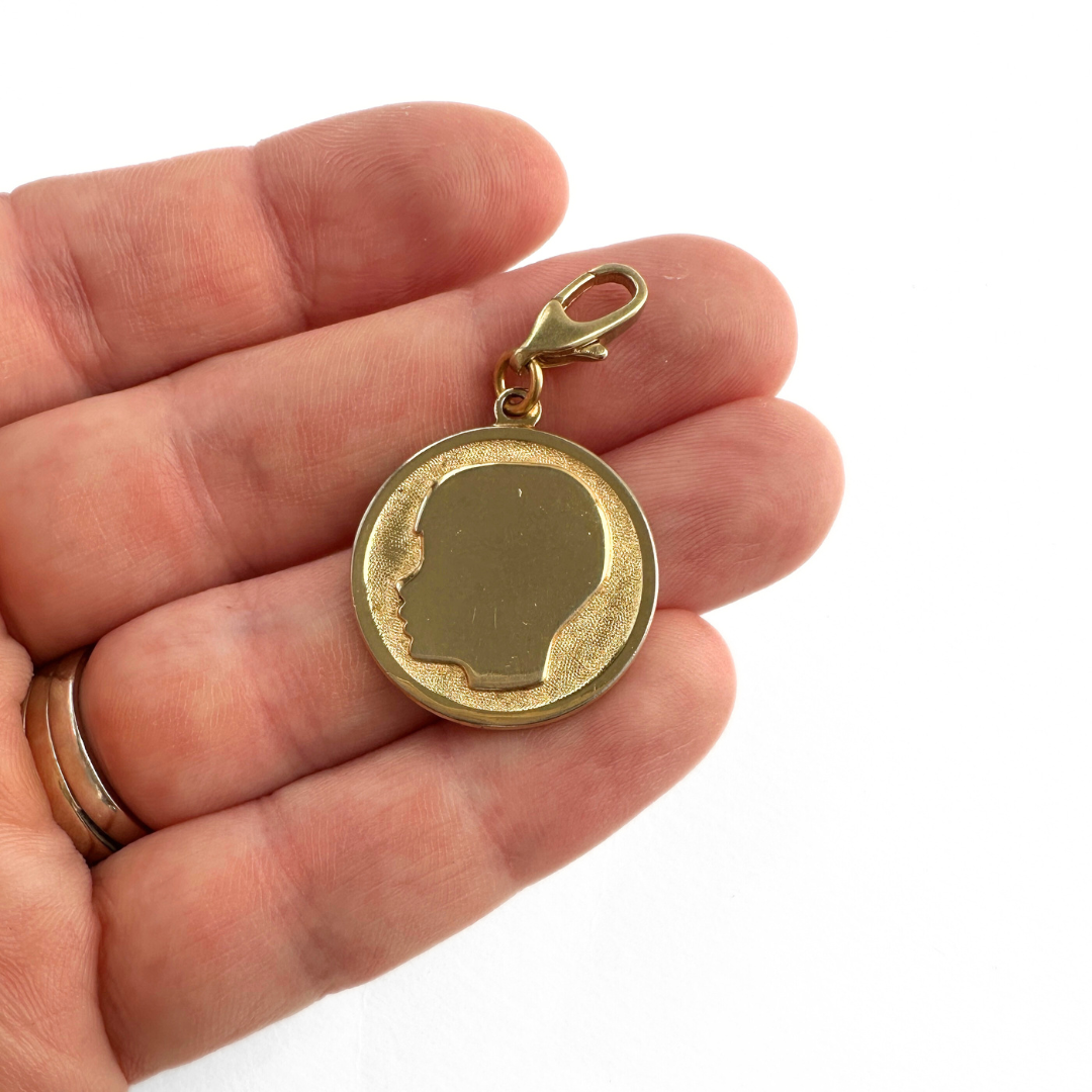 Vintage gold tone little boy silhouette circular charm
