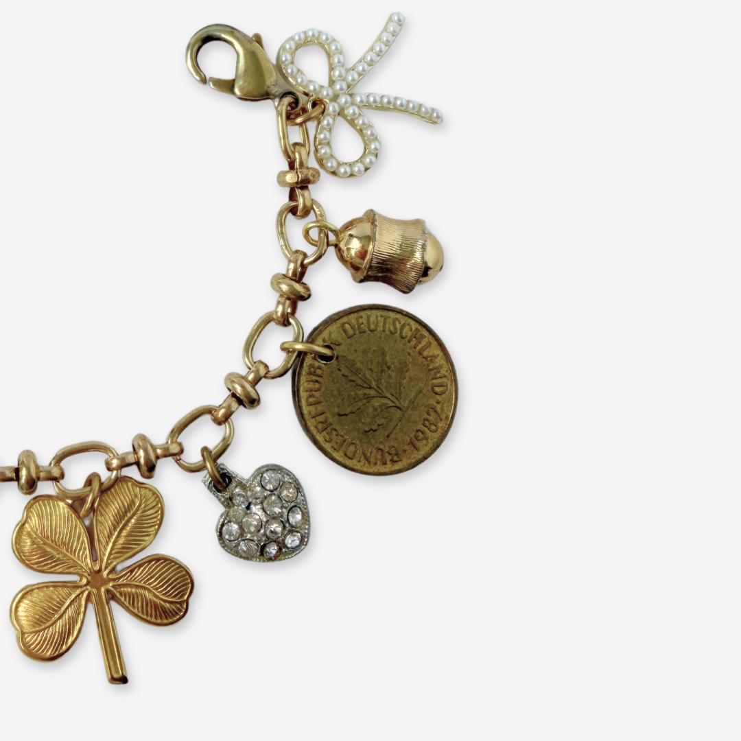 Repurposed vintage mixed neutral charm bracelet