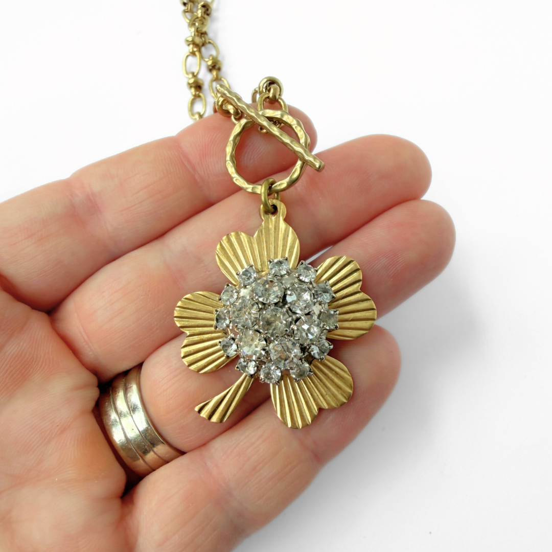 Large solid brass four leaf clover pendant with vintage clear rhinestone embellishment