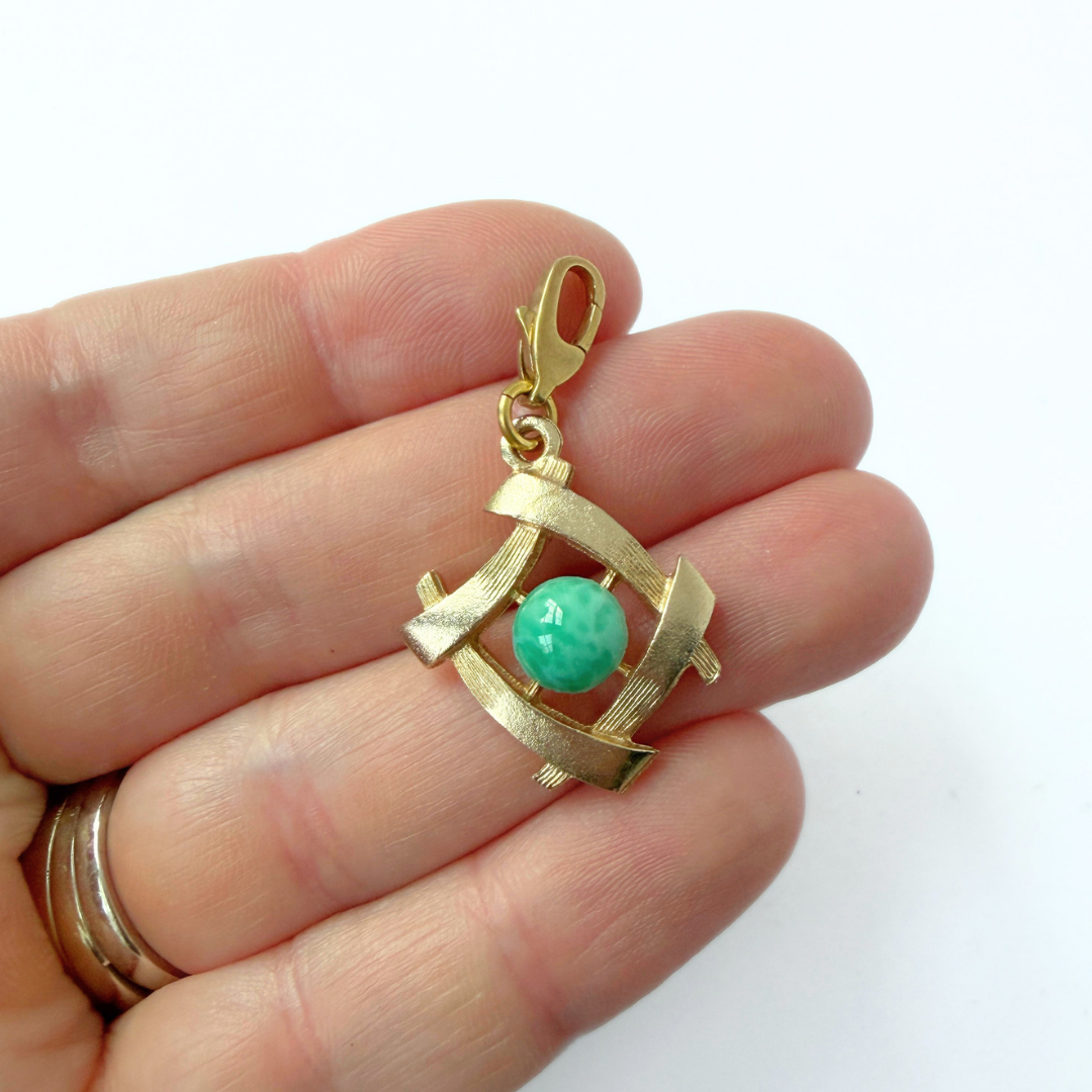 Vintage gold tone Asian-revival charm with jade glass stone