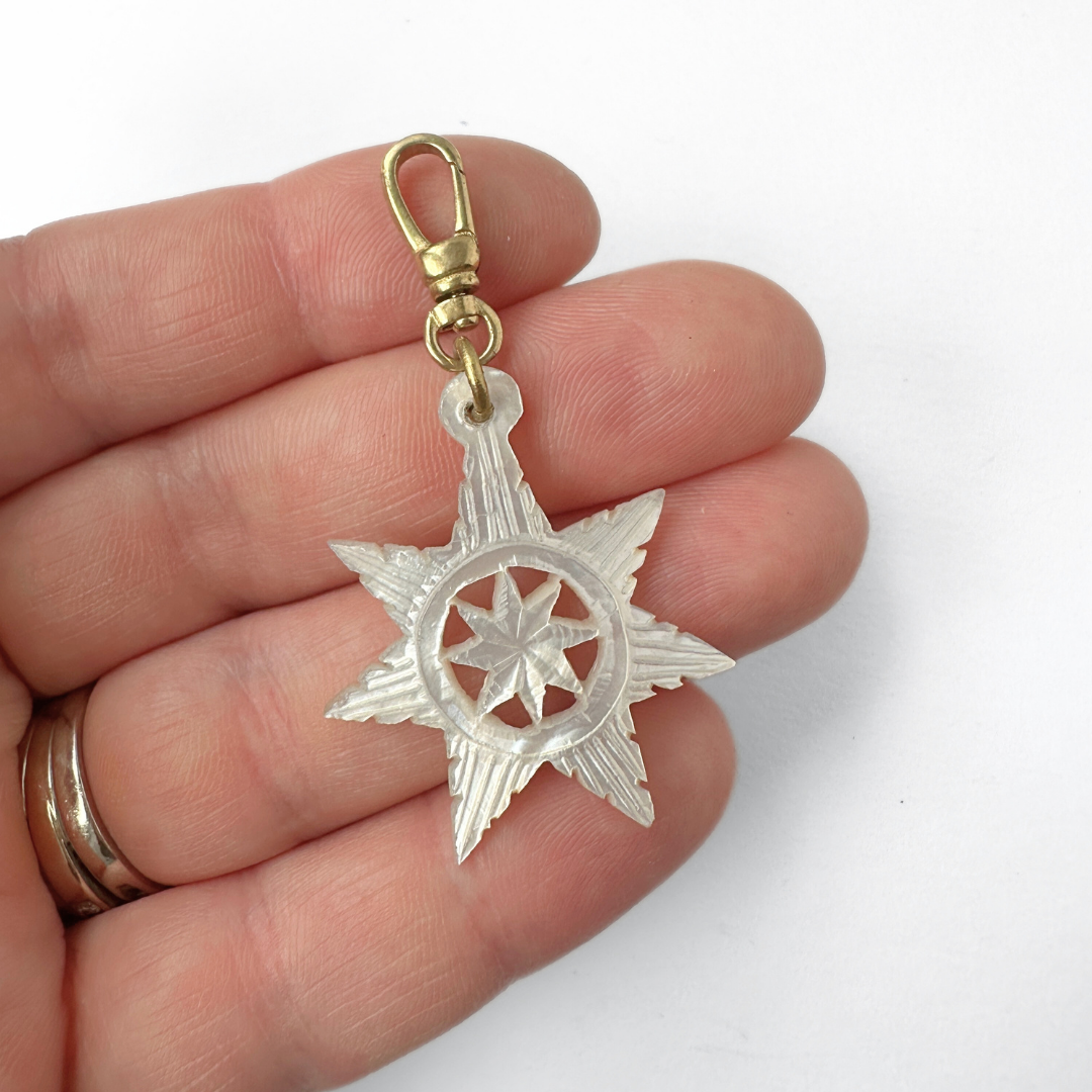 Vintage carved mother of pearl star charm