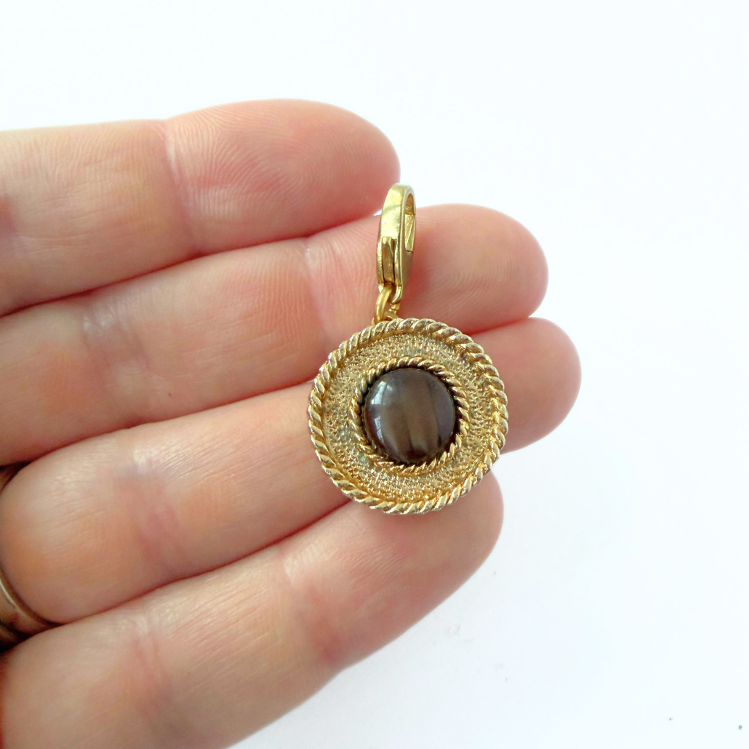 Refashioned Vintage gold tone circular charm with brown glass center