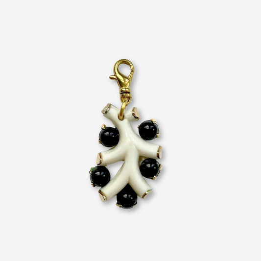 Vintage black and white celluloid charm with brass swivel clasp