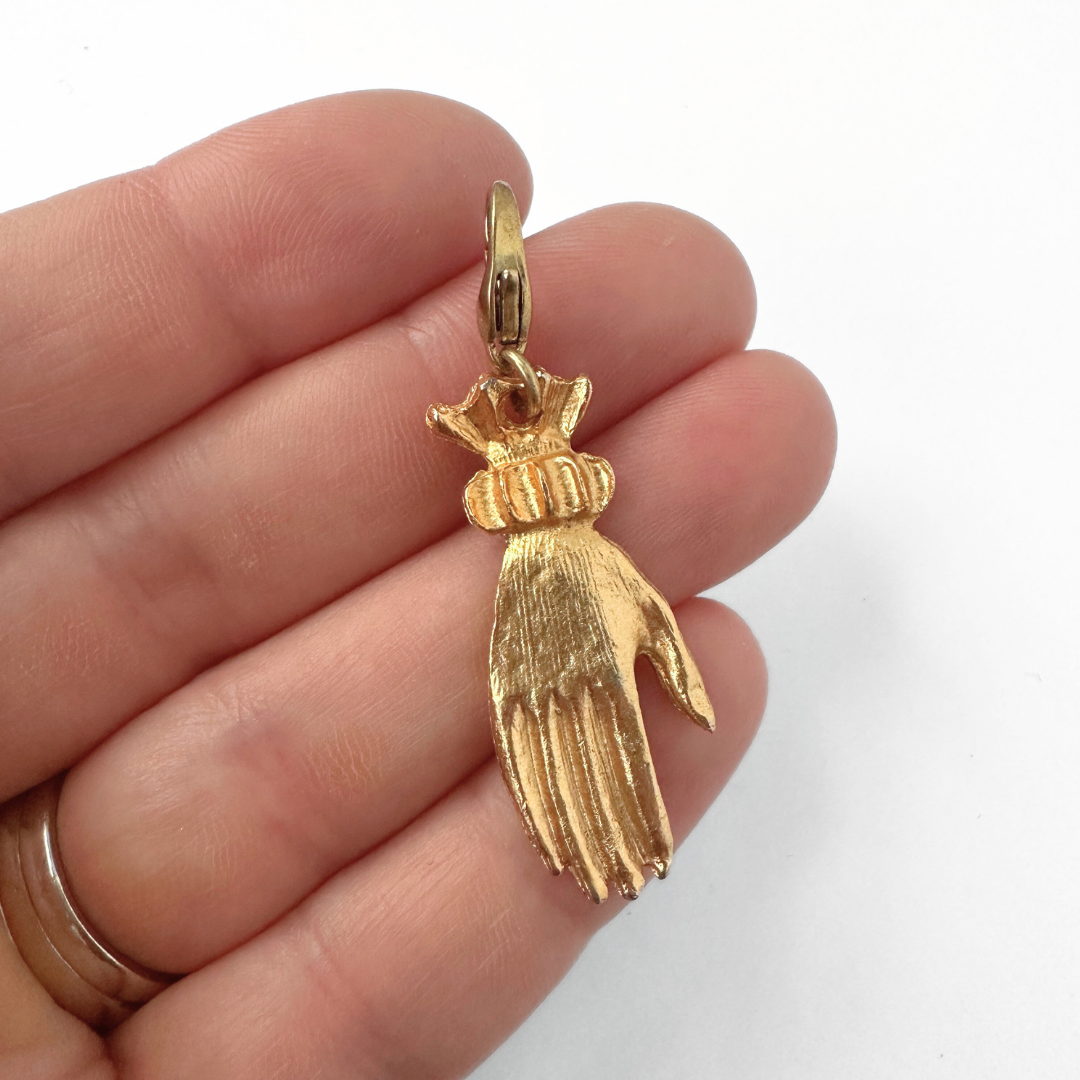 Vintage gold tone Victorian hand charm