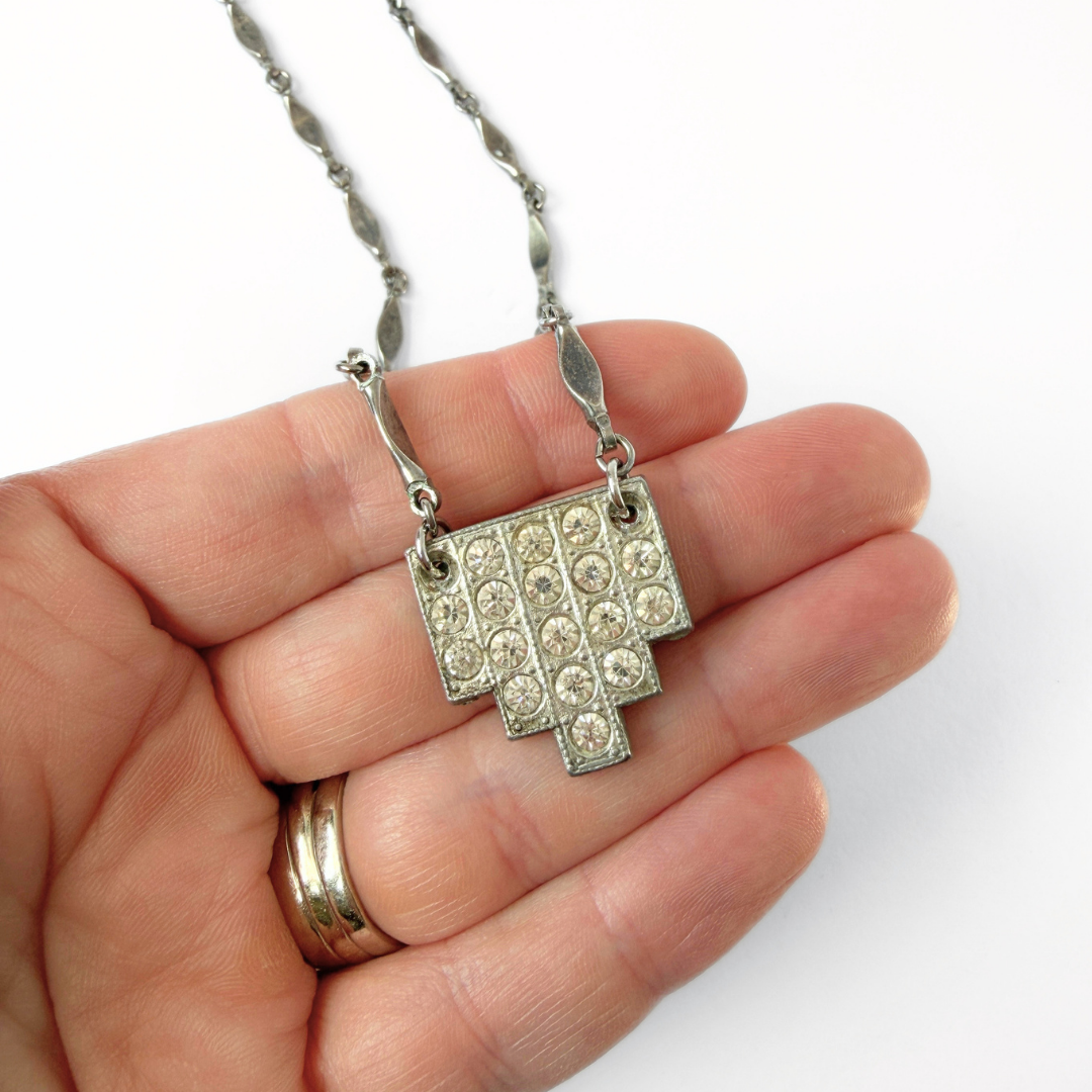 Vintage clear rhinestone deco pendant on aged silver bar chain