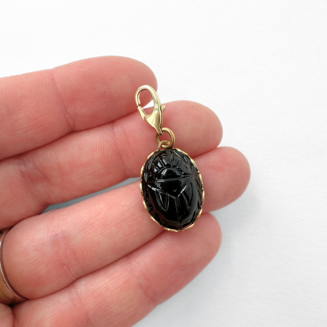 Vintage small black glass scarab charm in brass setting