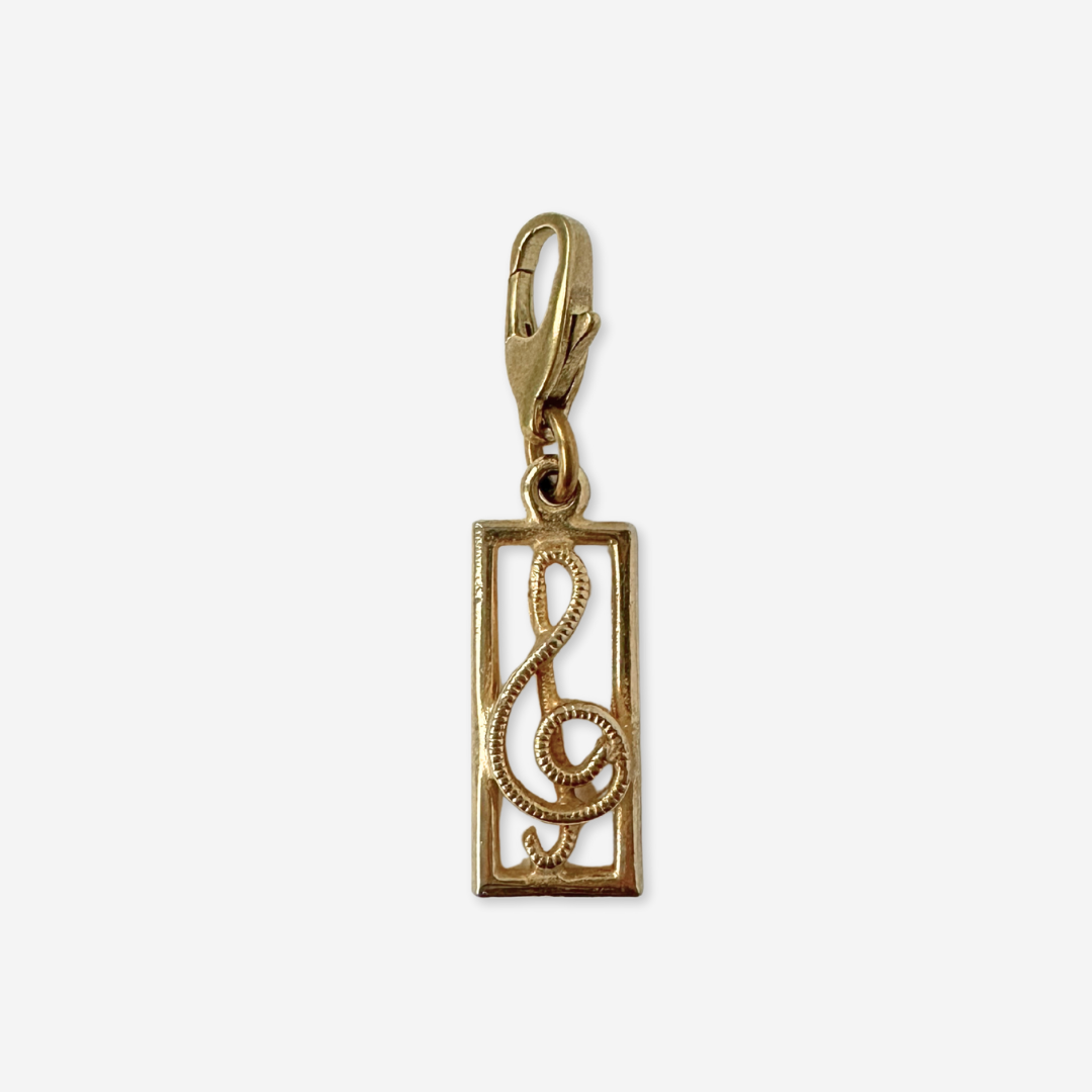 Vintage muted gold rectangular treble clef charm