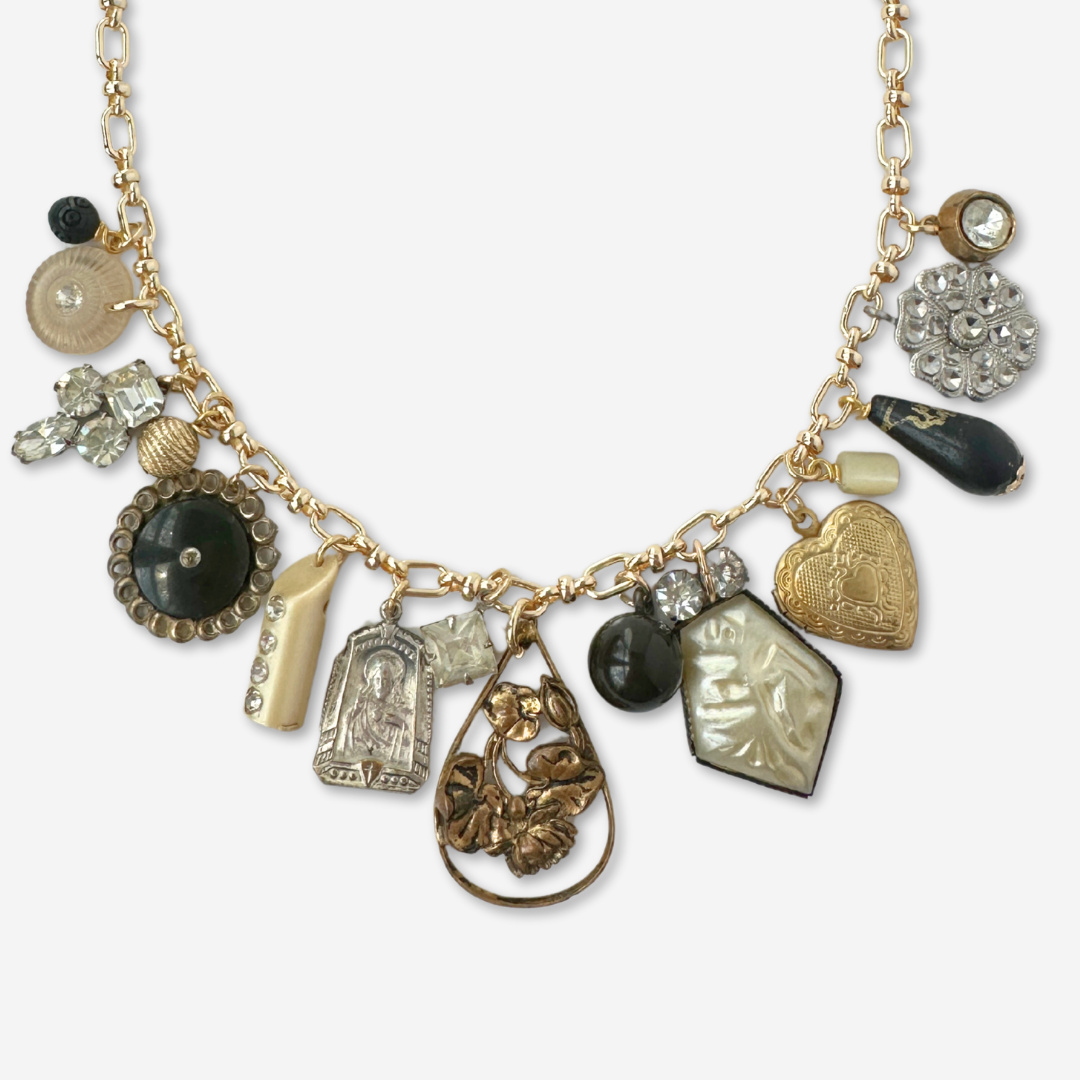 Repurposed vintage neutral charm necklace on gold plated chain