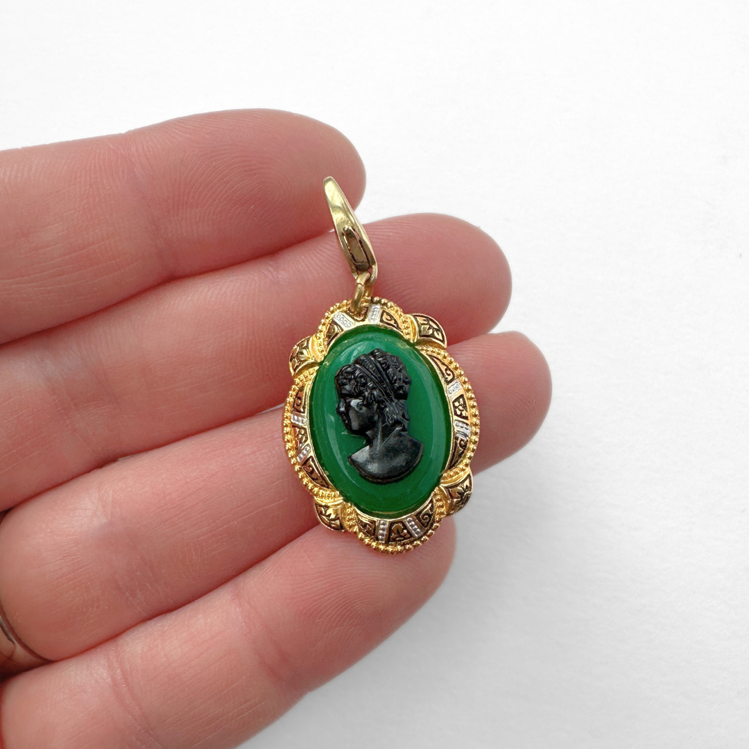 Vintage green and black cameo charm with decorative gold frame
