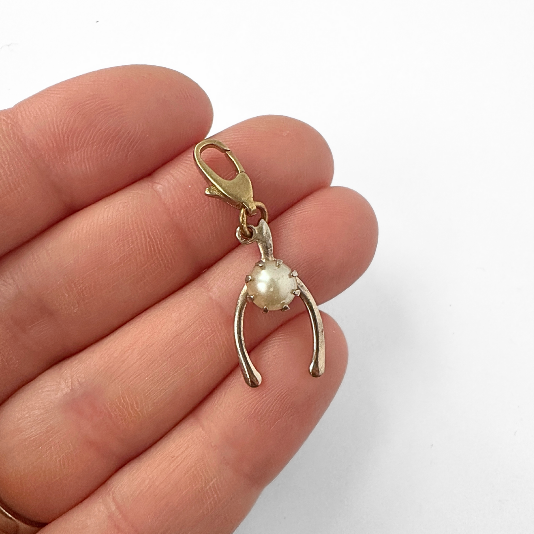 Dainty vintage muted gold wishbone charm with pearl accent