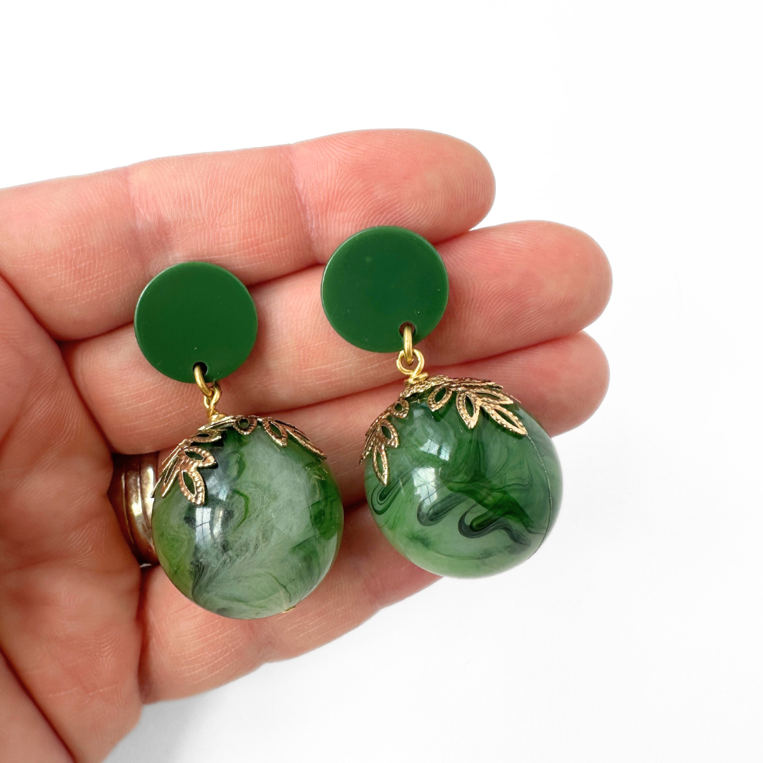 Oversized vintage green swirl bead earrings with brass leaf bead cap