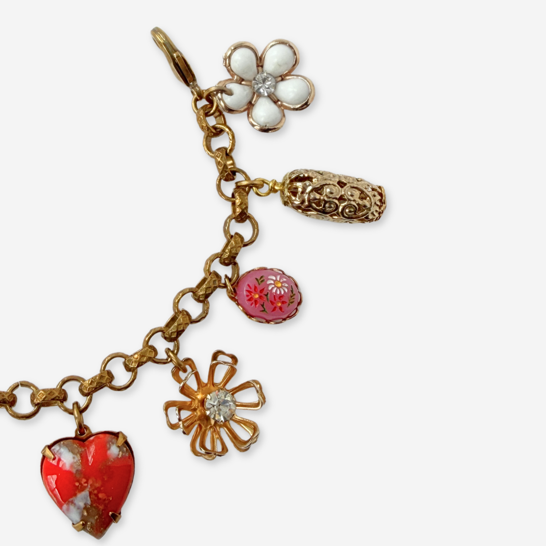 Red and pink repurposed vintage mixed charm bracelet