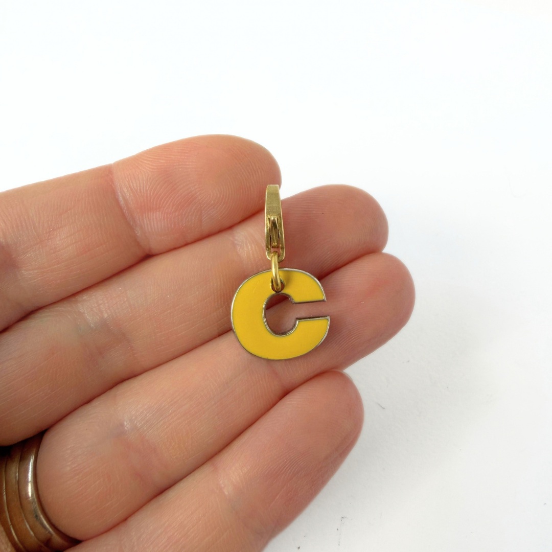 Small vintage yellow enamel letter "C" charm