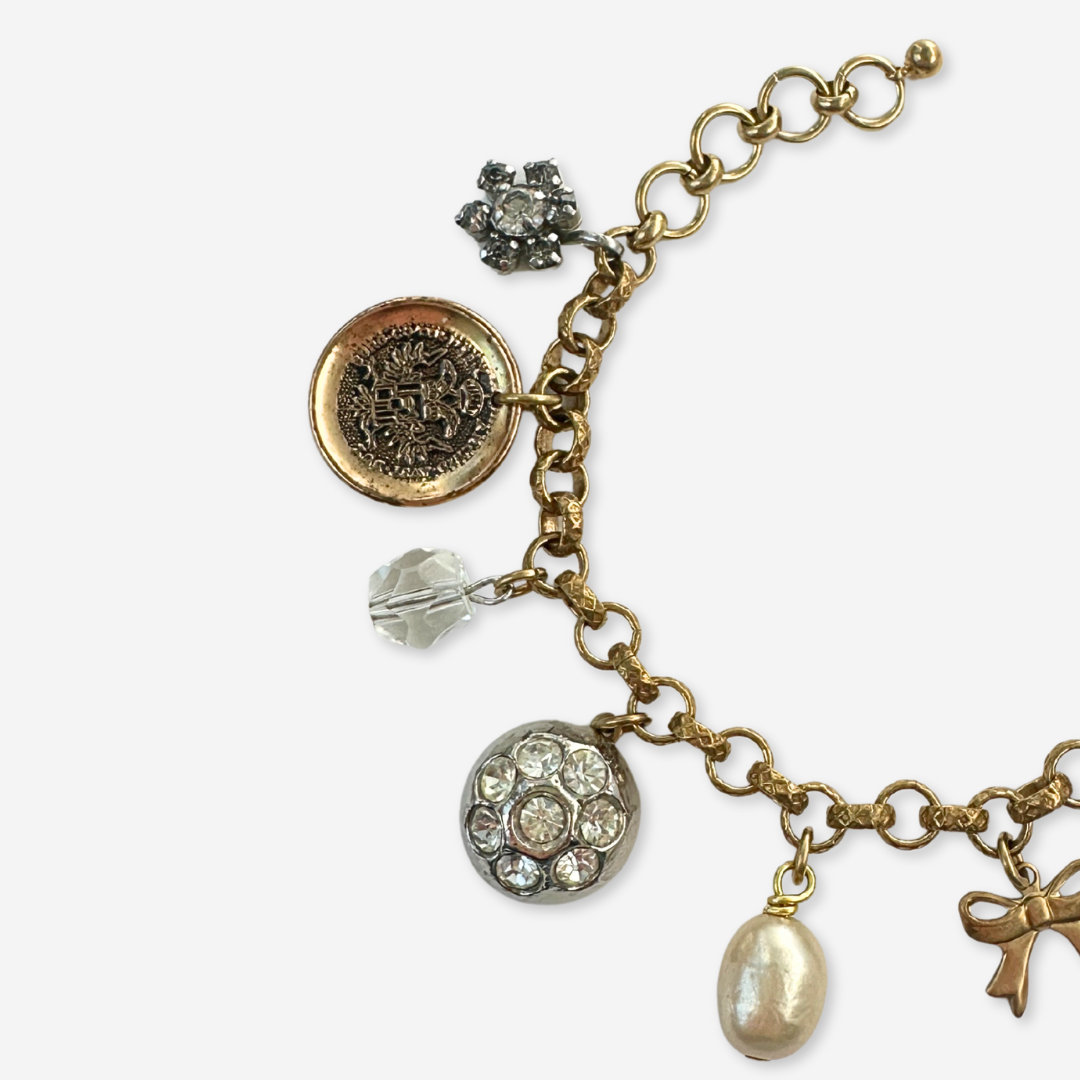 Repurposed vintage neutral mixed charm bracelet
