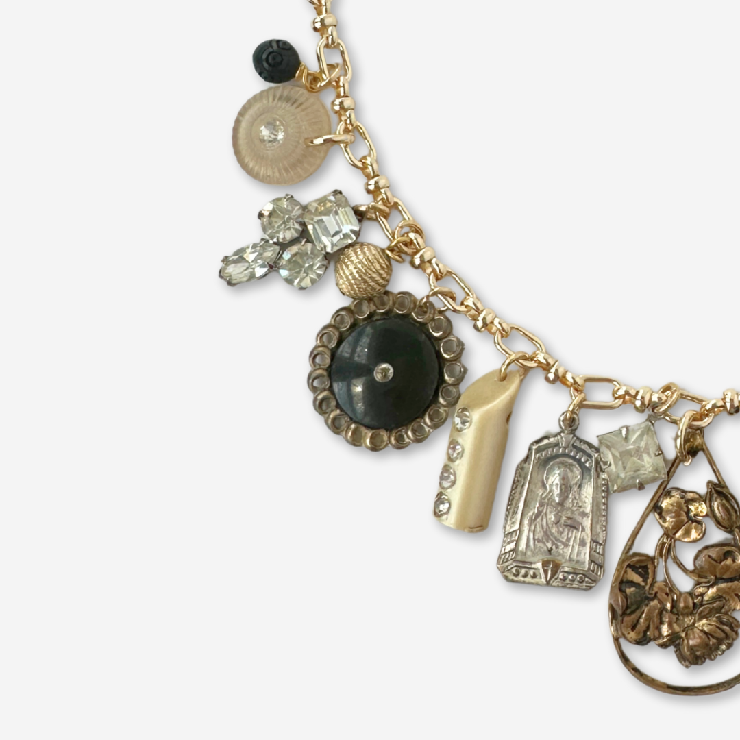 Repurposed vintage neutral charm necklace on gold plated chain