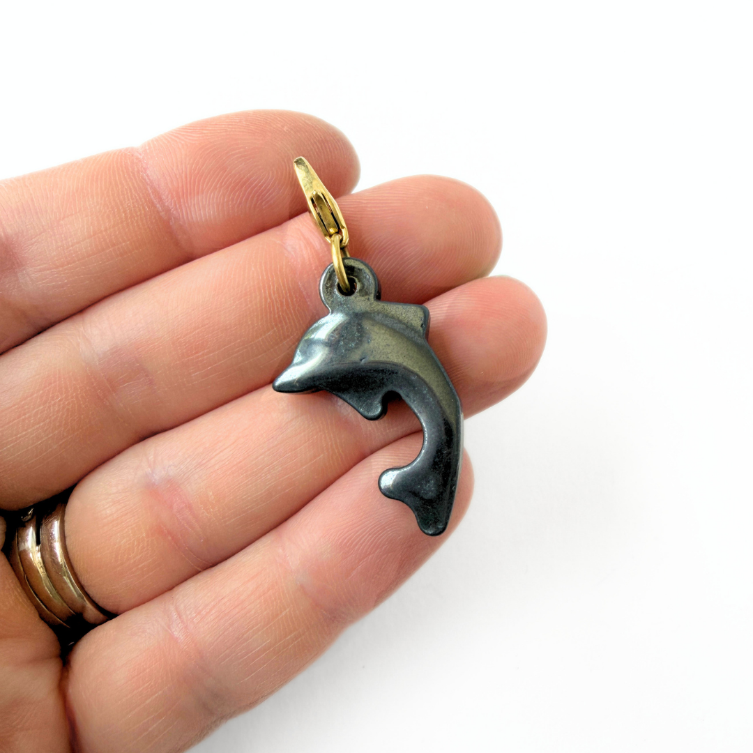 Vintage carved hematite dolphin charm