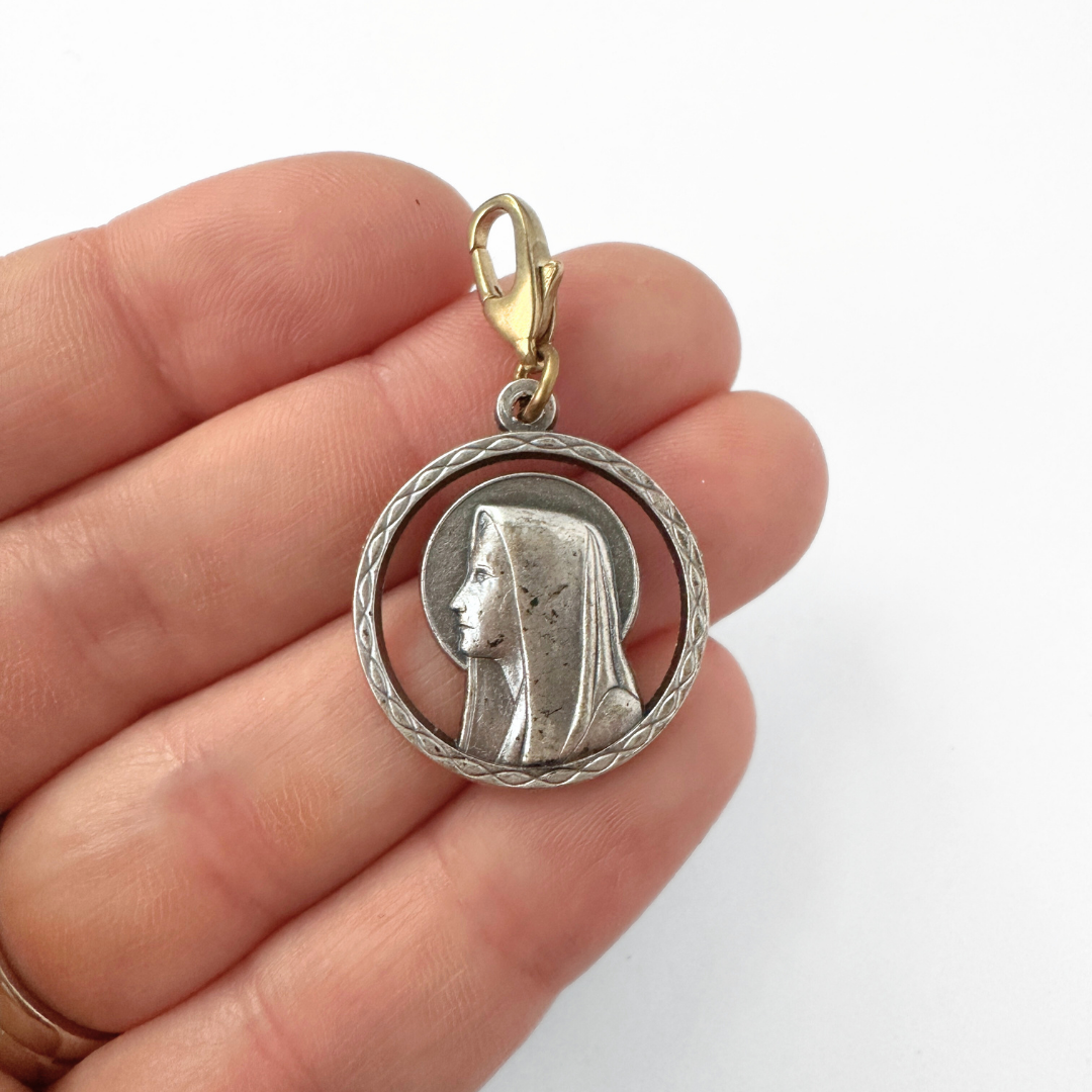 Vintage aged silver Blessed mother circular charm