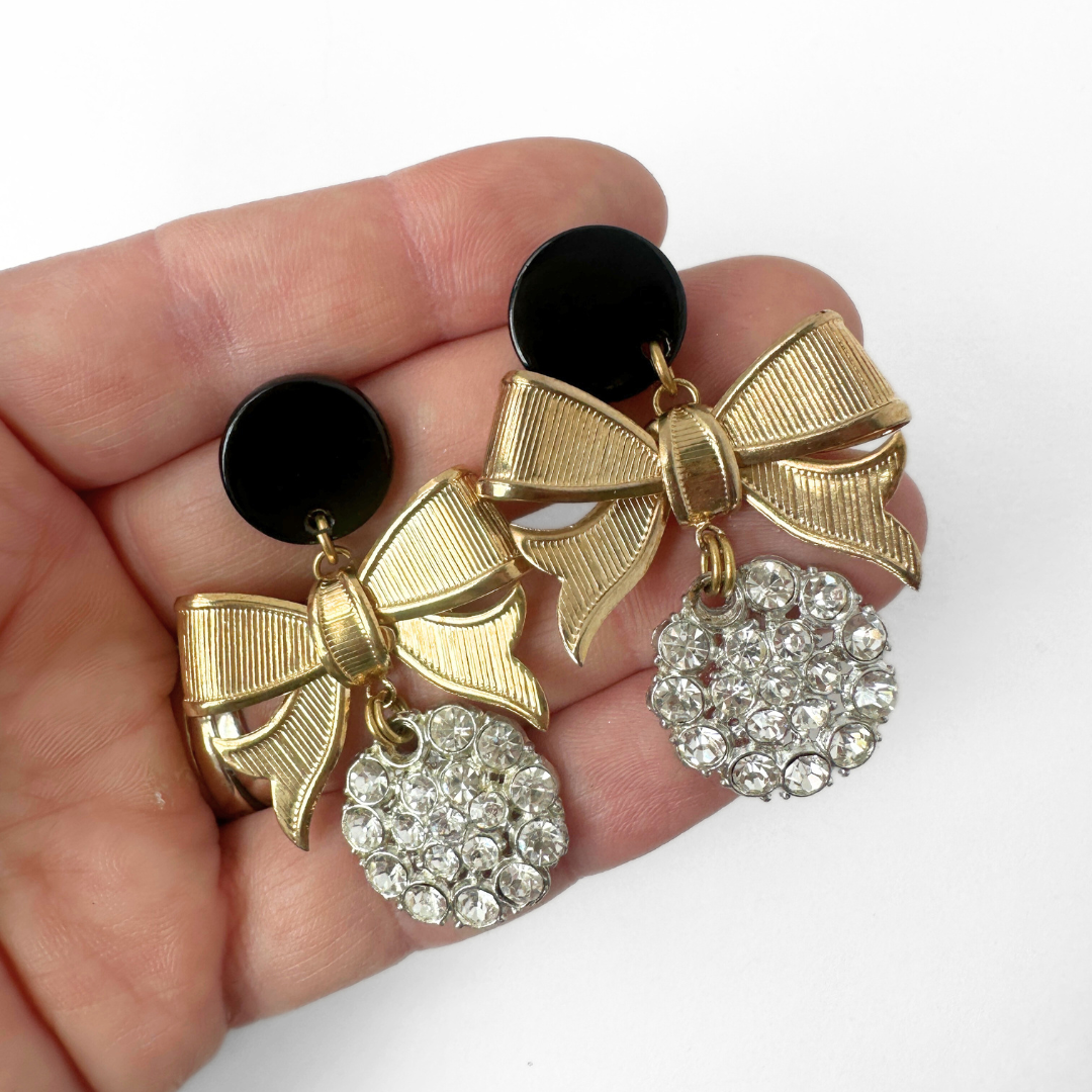 Vintage clear rhinestone button earrings with gold bows and black posts