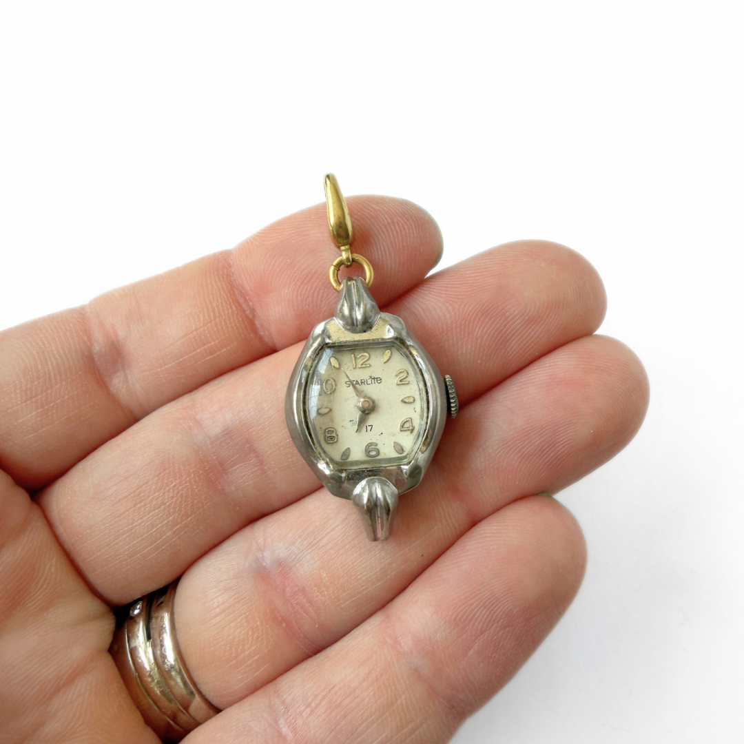 Vintage silver tone "Starlite" watch face charm