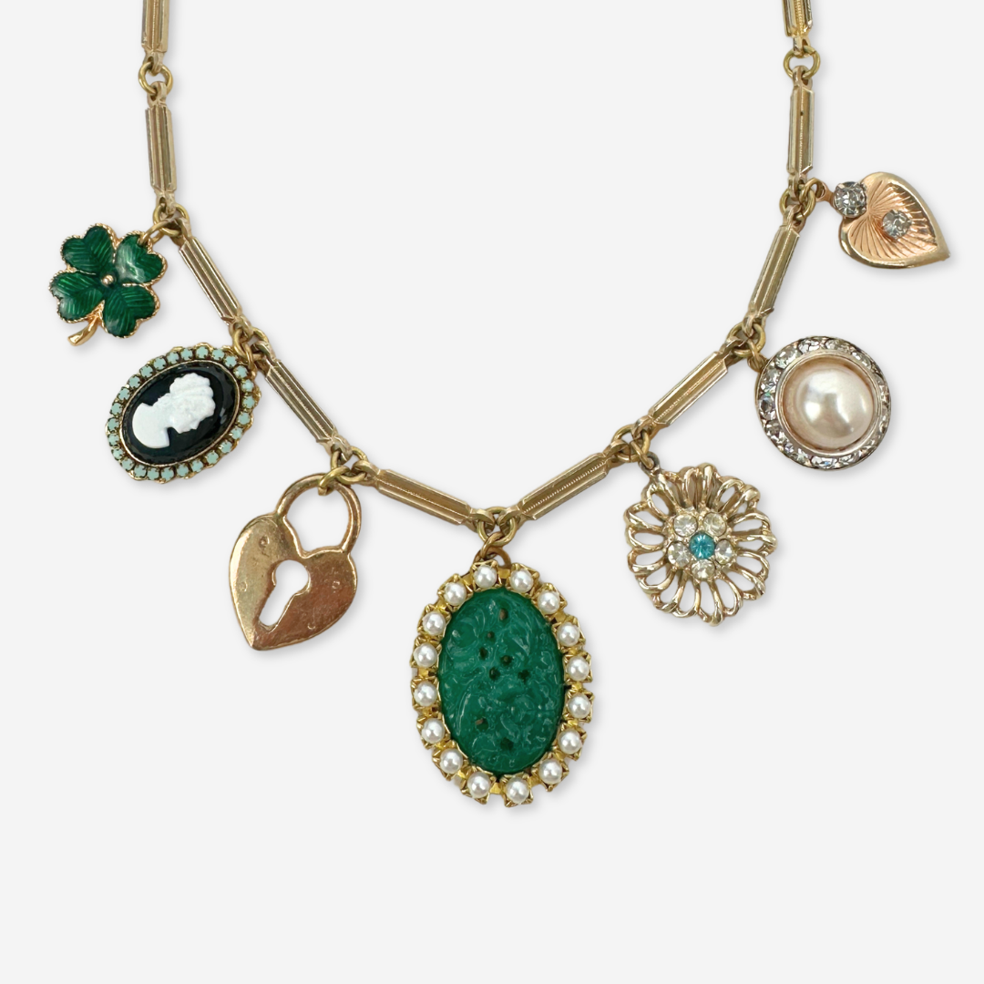 Repurposed vintage green and gold mixed charm necklace