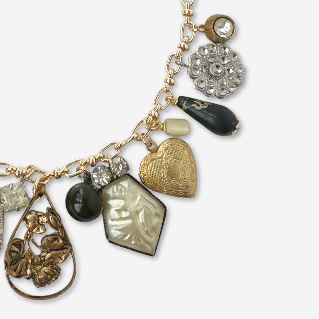 Repurposed vintage neutral charm necklace on gold plated chain