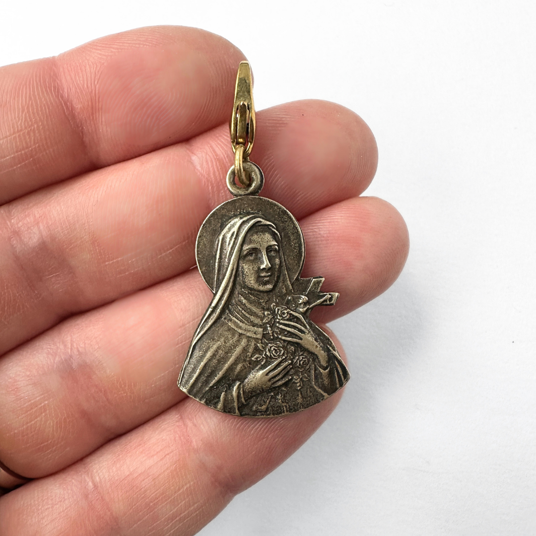 Vintage aged silver Saint Therese silhouette charm
