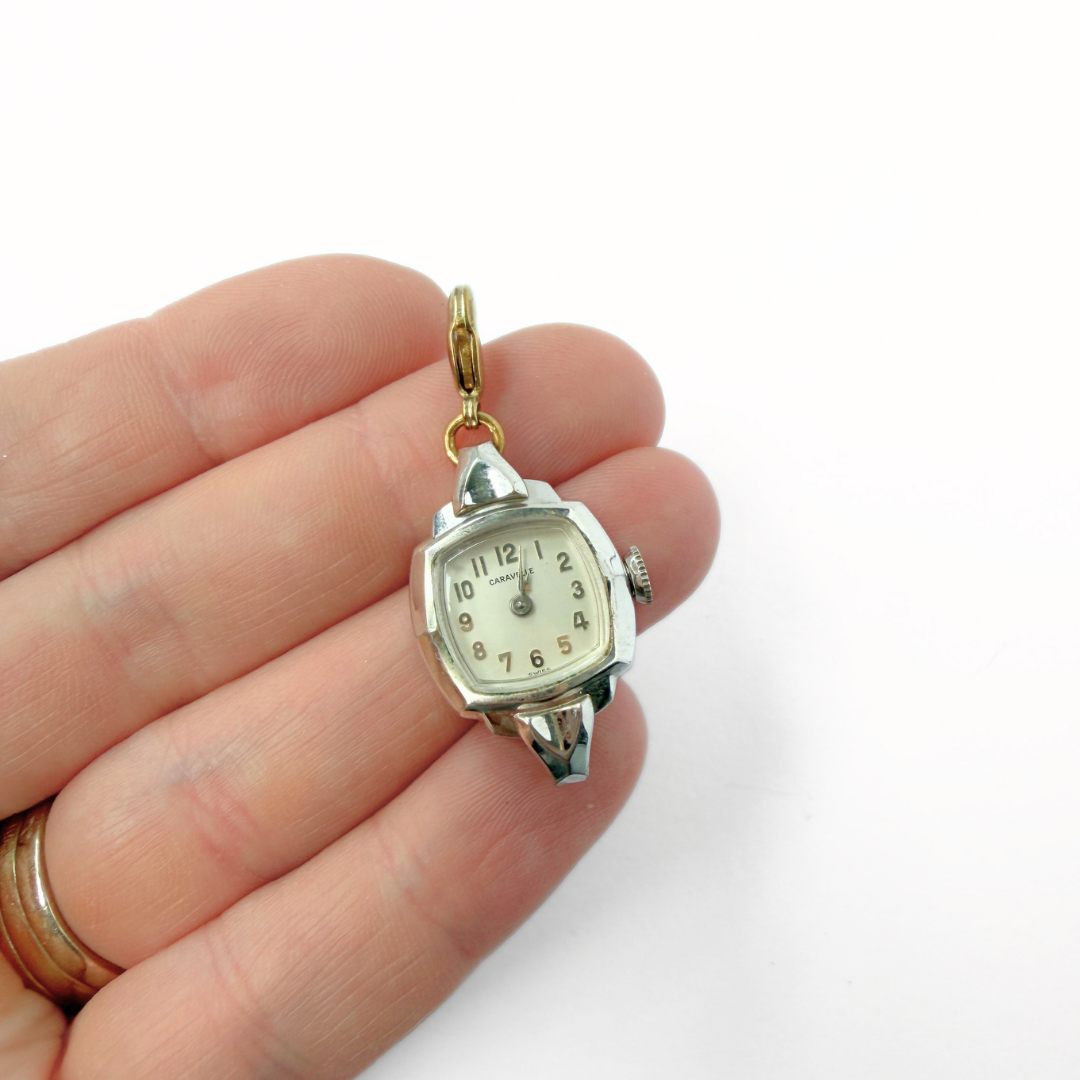 Vintage silver tone "Caravelle" Swiss watch face charm