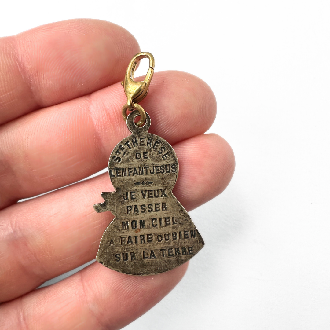 Vintage aged silver Saint Therese silhouette charm