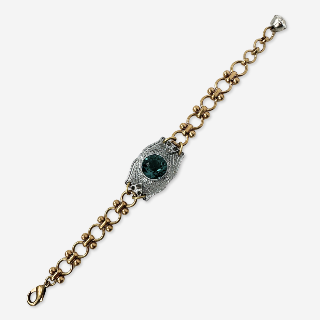 Repurposed silver filigree bracelet with montana blue centerpiece