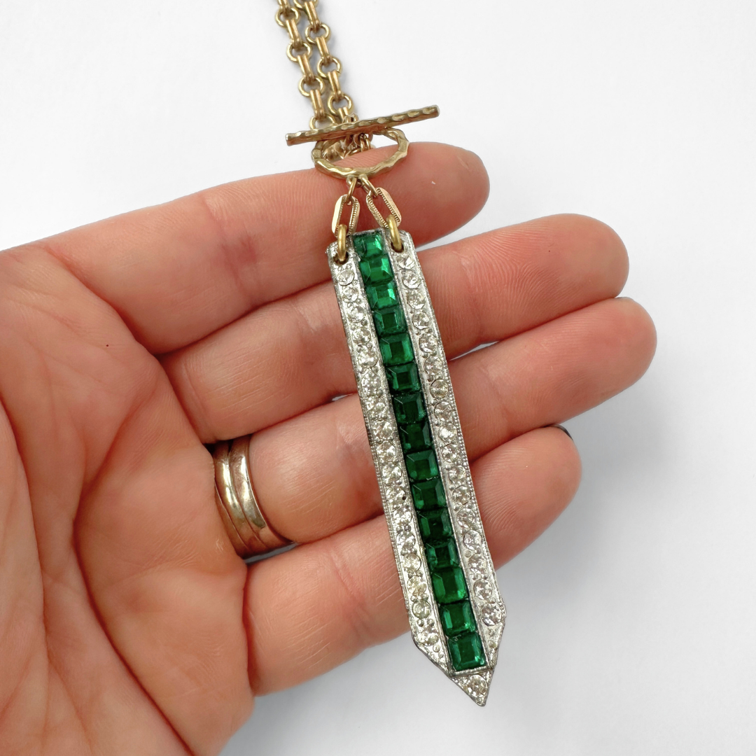 Vintage clear and emerald rhinestone elongated deco pendant with brass chain