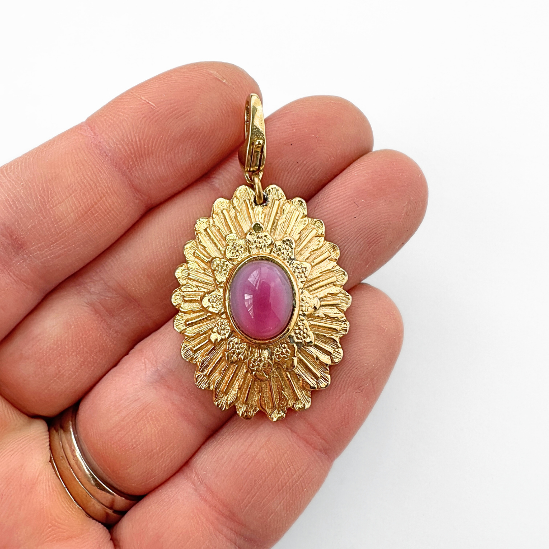 Vintage large gold oval sunburst charm with pink moonstone center
