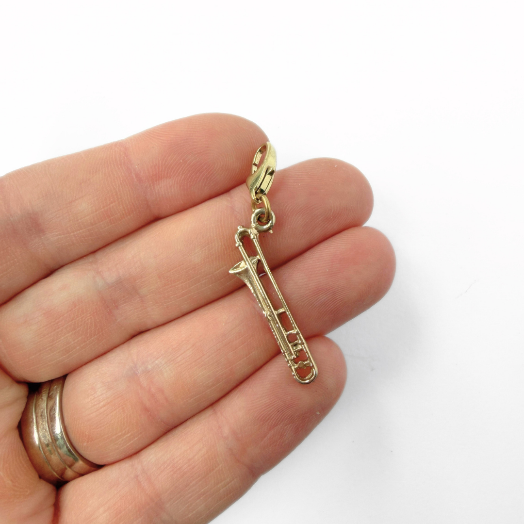 Vintage muted gold trombone charm pendant