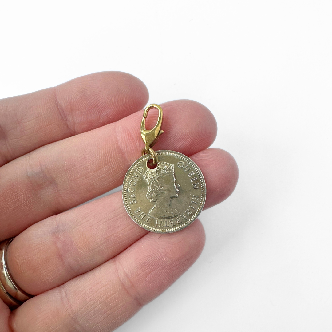 Vintage muted gold tone 1955 Queen Elizabeth coin charm