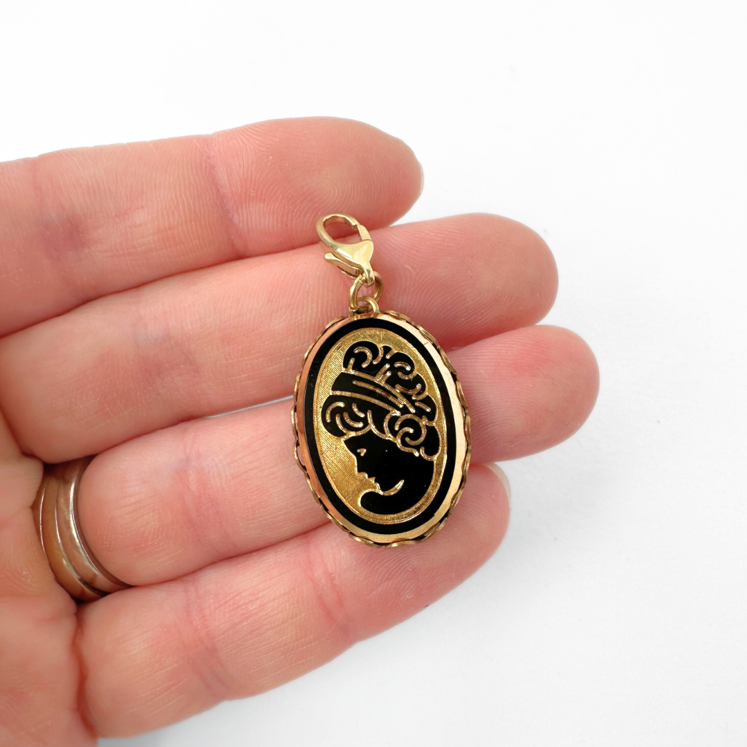 Vintage black and gold oval glass cameo charm