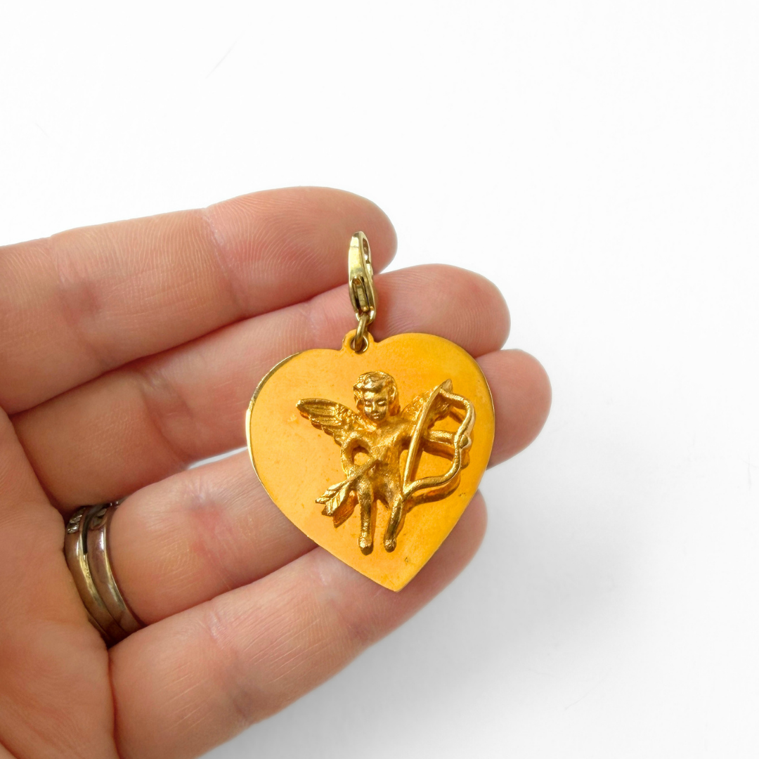 Large vintage bright gold Cupid heart charm