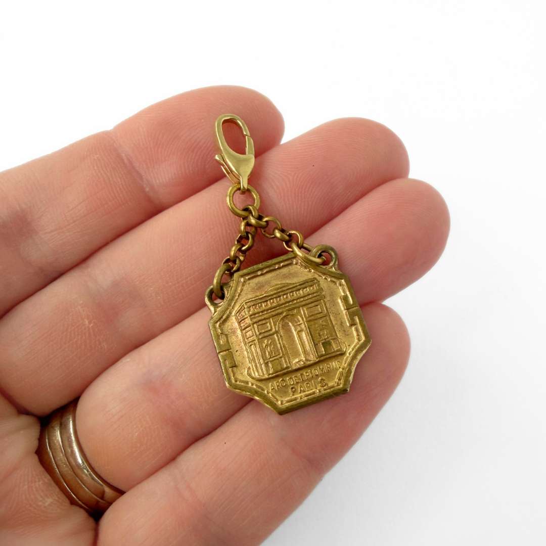 Vintage aged brass Parisian landmark medal charm: Arc de Triomphe