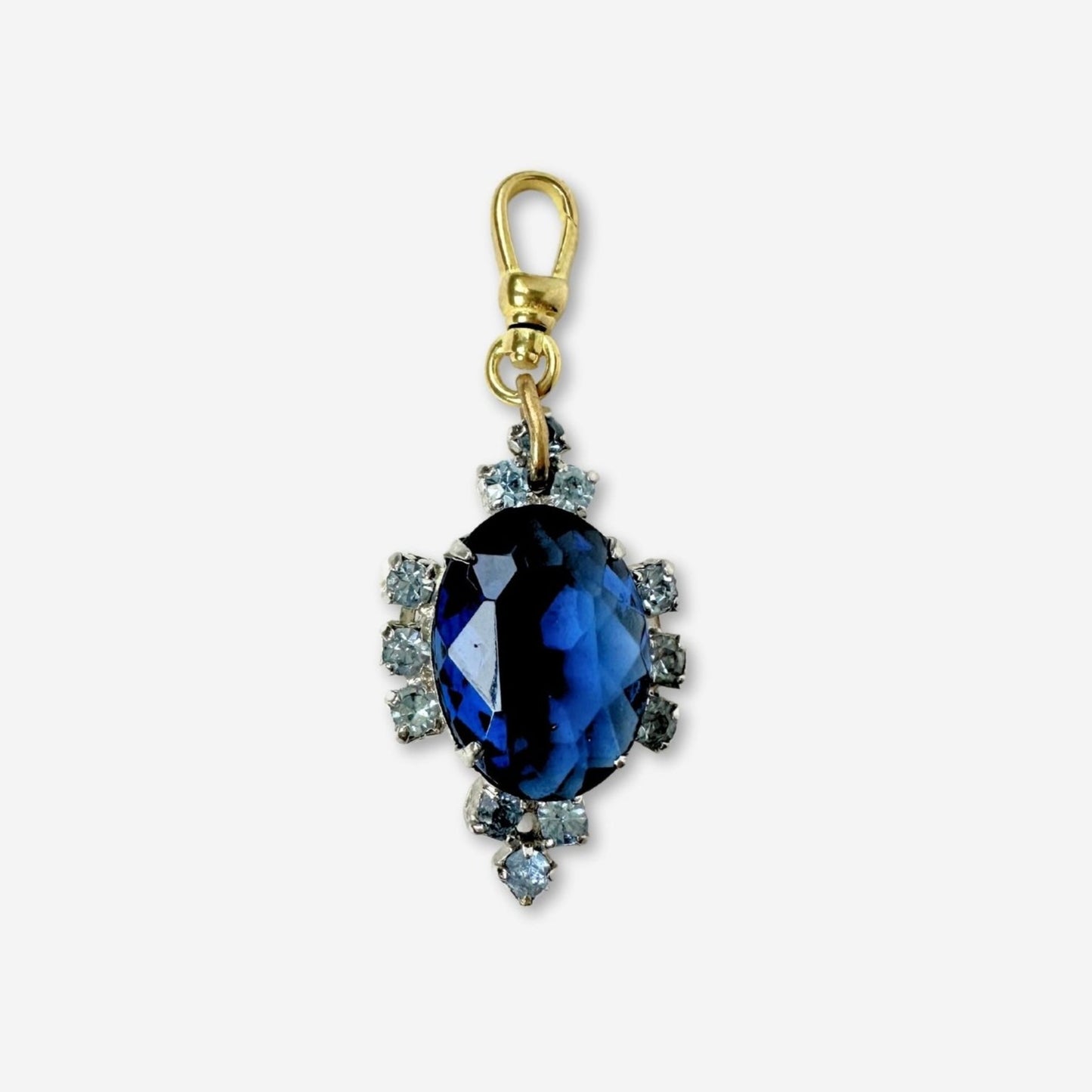 Vintage sapphire blue oval rhinestone charm with raw brass swivel clasp