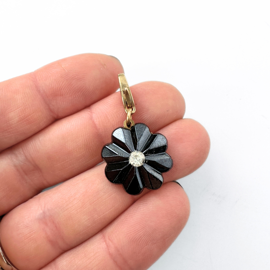 Vintage carved hematite flower charm with rhinestone center